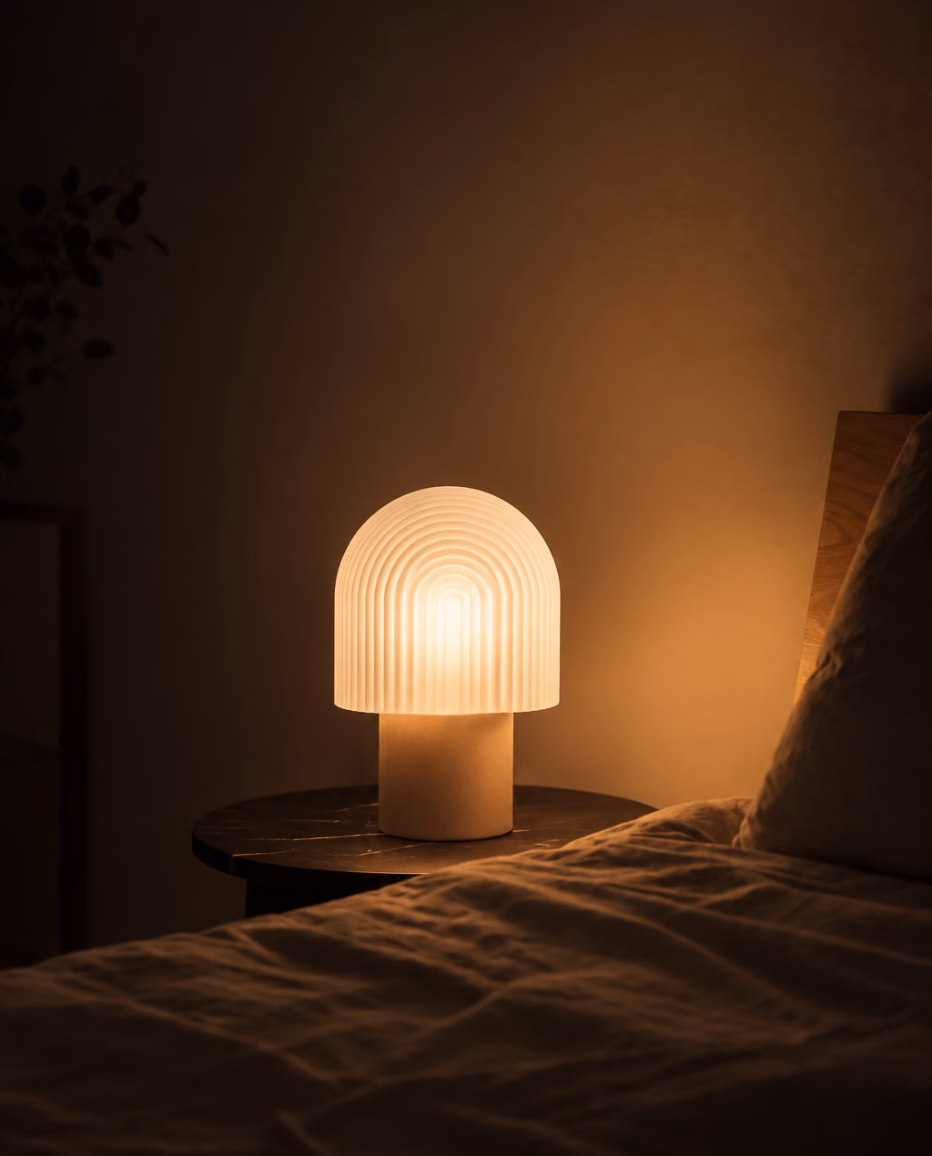 DOMEA table lamp lighting a dark bedroom at night
